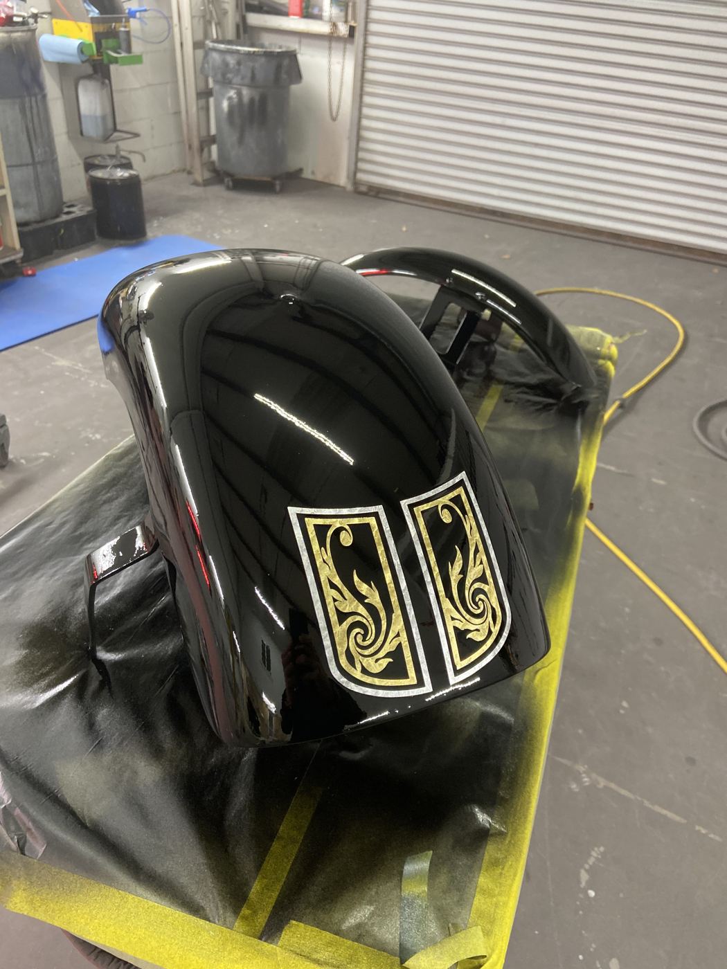 Black fender with gold leaf panels